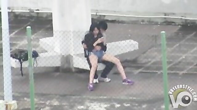 Horny Asian student bangs girlfriend outdoors on rooftop