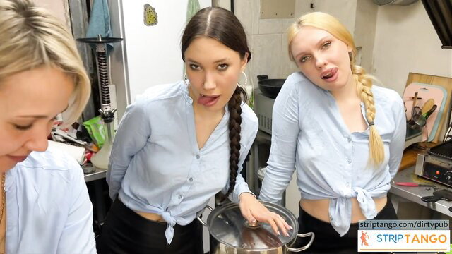 Three hot blonde and brunette babes in tied shirts tongue out in kitchen tease