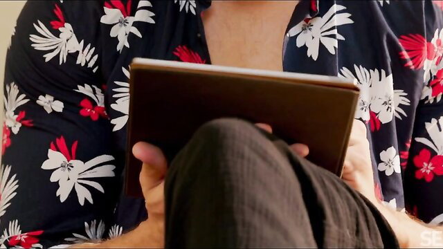 Lilly Mays in kimono holding tablet, teasing cleavage SexArt