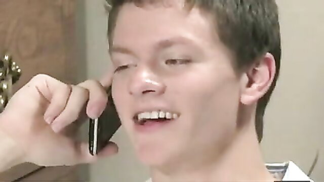 Young student guy smiling on phone, flirting with teacher in amateur vid