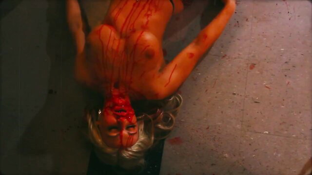 Amy Groening nude bloody corpse pose, tits out in horror scene