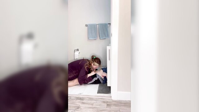 Mom on bathroom floor kissing son's cock in taboo blowjob
