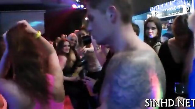 Tattooed hunk surrounded by hot girls at slippery wet orgy party