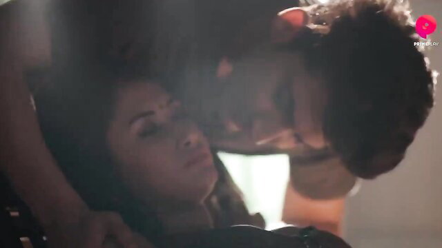 Indian couple intimate embrace, man kissing woman's neck passionately