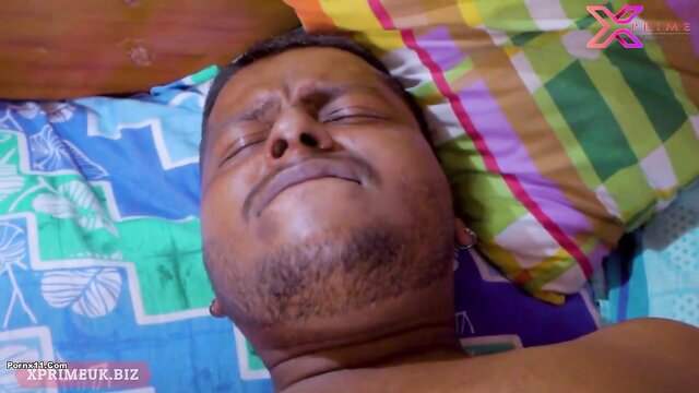 Indian man asleep shirtless on bed in steamy adult scene