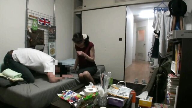 Japanese mature working woman in tight tank top caring for lying man