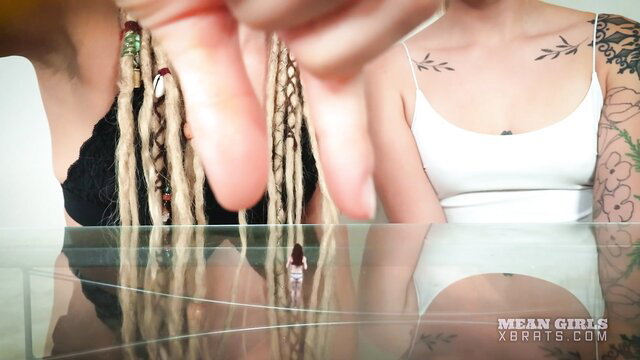 Giant tattooed dreadlock girl towers over tiny doll in Mean Girls giantess tease