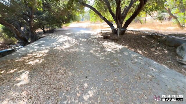 Hailey Rose outdoors on sunny path, RealTeensBang watermark