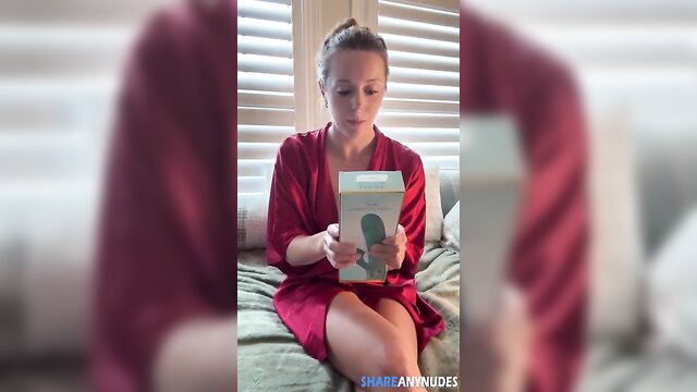 Nadia Foxx in red satin robe holding vibrator toy nude OnlyFans leak