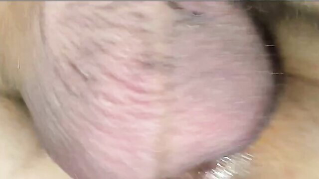 Closeup of man's hairy erect cock and balls in amateur cuckold video