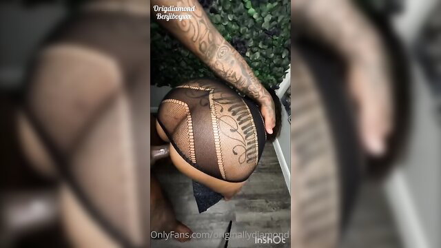 OG Diamond thick black ass in fishnets grabbed by tattooed hand