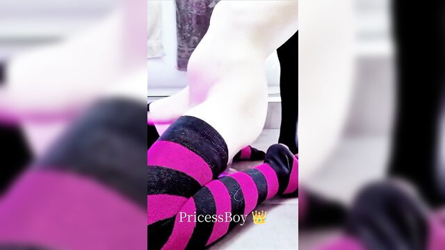 Pale femboy in pink black stockings plays with horse dildo toy