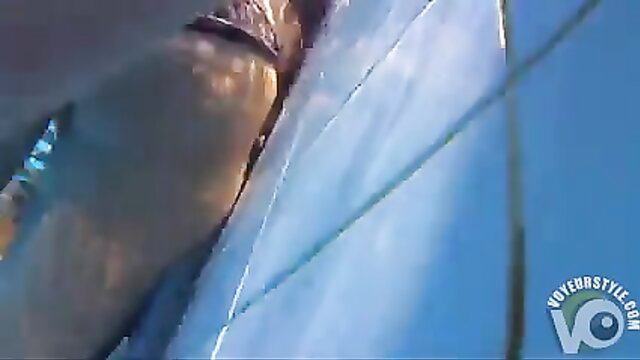 Playgirl tugs friend's dick underwater in pool POV