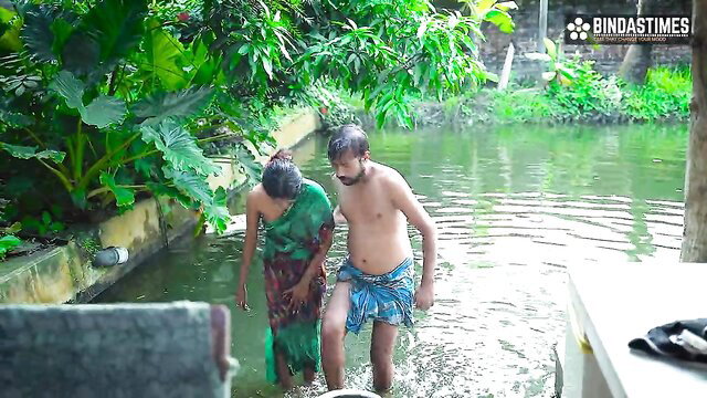 Indian maid in saree with topless guy in outdoor water fun