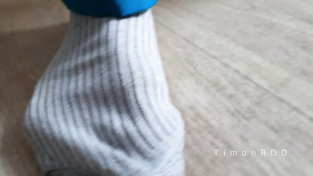 Closeup of man's gray ribbed socked foot with blue cap, TimonRDD adult video