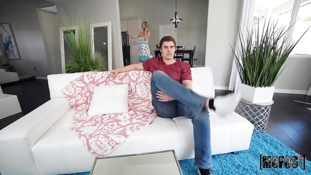 Kit Mercer hot MILF in skimpy dress teases on couch