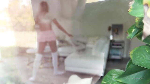 GwenGwiz in pink micro shorts and thigh high stockings bending over