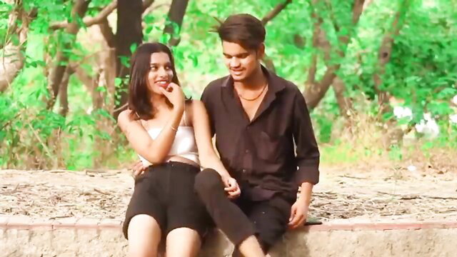 Hot Indian bhabhi in shorts teases with guy outdoors in steamy vid