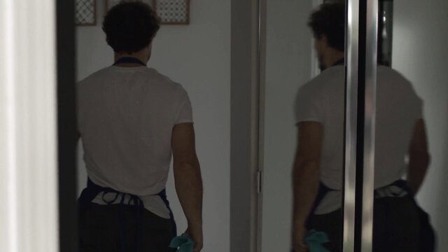 Alison Rey as maid in apron, muscular Black man behind her