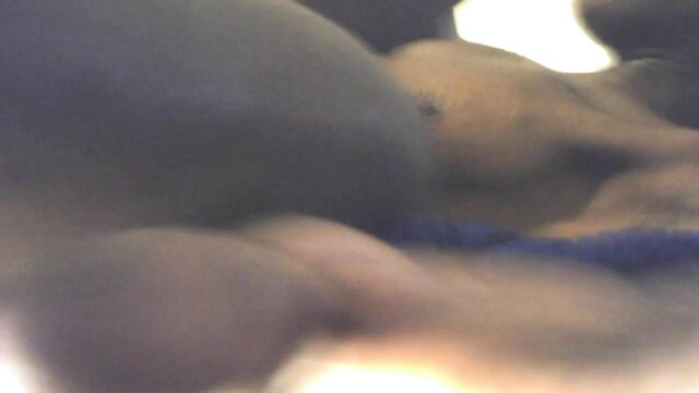 Blurry closeup of thick black MILF's huge dark tits and curves