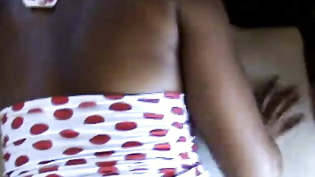 Dark-skinned woman in polka dot underwear