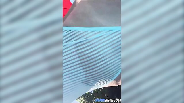 Estephania Ha nude boobs exposed under wet striped bikini poolside