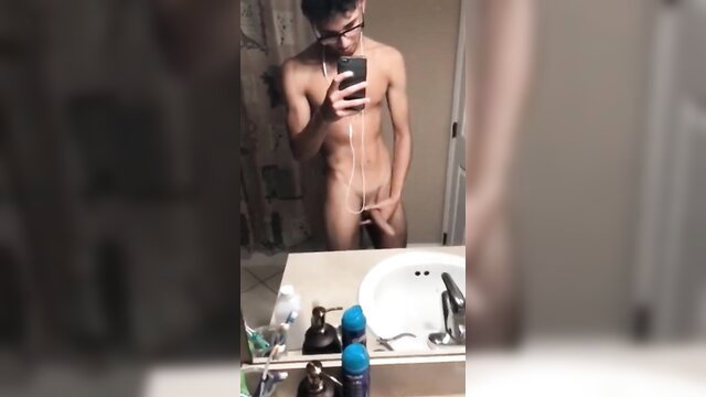 Slim Asian guy nude selfie in bathroom, stroking cock on Snapchat bait