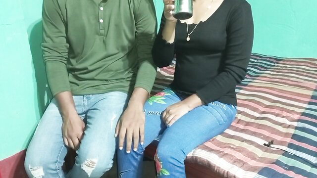 Steamy Desi couple in tight jeans and tops, intimate moment on bed