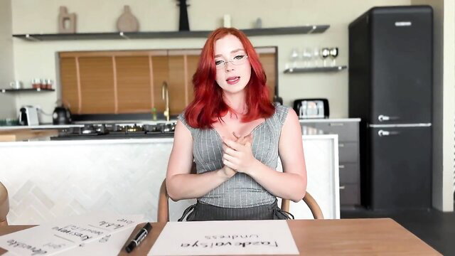 Sweetie Fox redhead in grey tank top, glasses, flirty pose kitchen