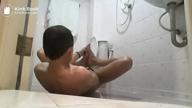Thai guy self footjob toejob in shower, bare feet on cock