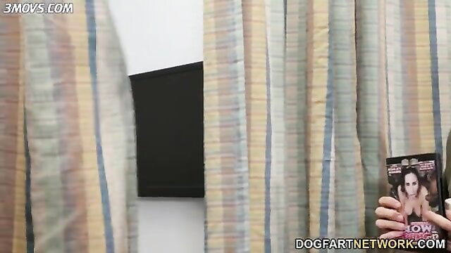 Lilly Bell holding BBC DVD cover, teasing in hotel room