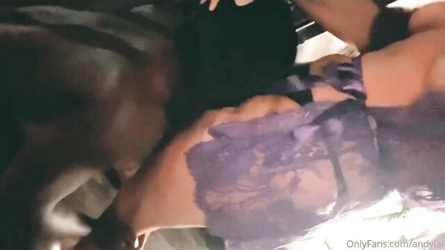 Andy Jaide in purple lingerie gives blowjob to BBC on couch
