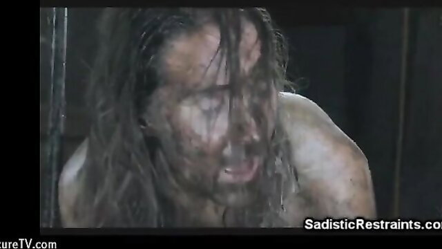 Sadistic Restraints broken slut tortured in dark room, muddy face closeup