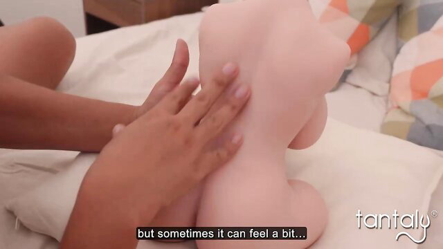 CaribbbeanBoy massaging pink sex doll ass in tantalizing bedroom scene