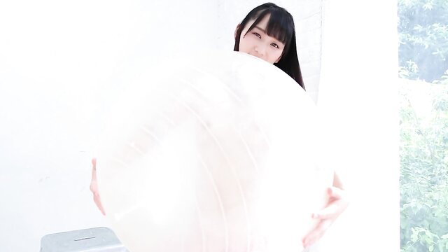 Japanese JAV babe with huge tits holding massive breasts close-up