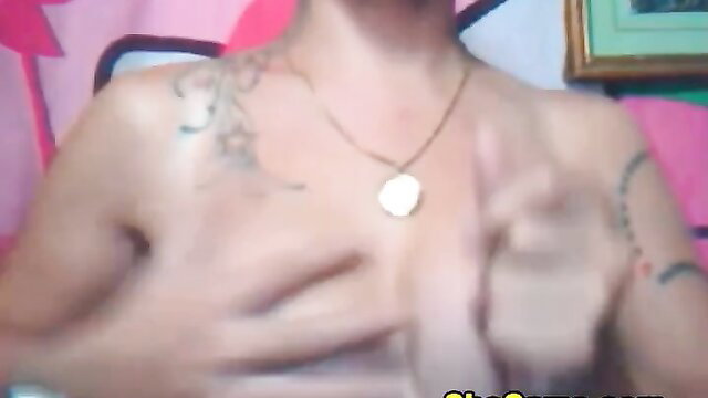 Tattooed shemale grabs huge tits closeup in horny teaser