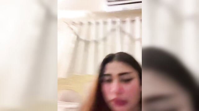 Chubby Indian girl closeup in shower, wet hair lips parted