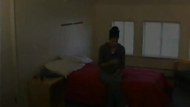 Brandi Love in gray hoodie sitting on bed, spanking fetish thumbnail