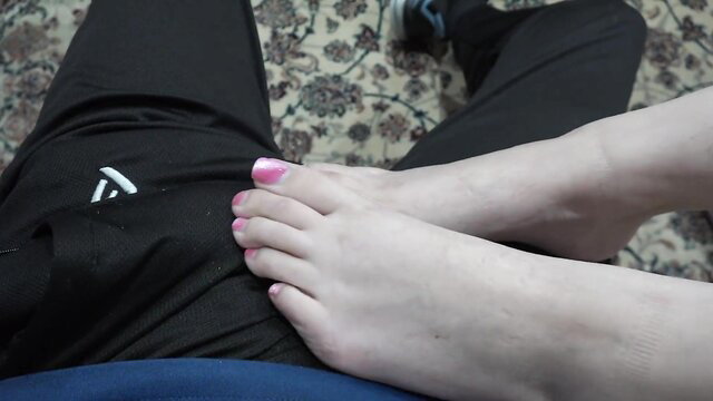 Julia James' sexy bare feet with pink toes in footjob tease
