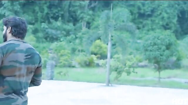 Indian army soldier in camouflage back view jungle outdoor scene