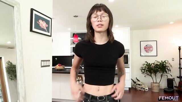 Asian trans babe in crop top and low jeans exposing toned abs