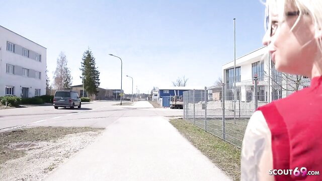 Blonde German Scout Malina in red top, outdoor street casting tease