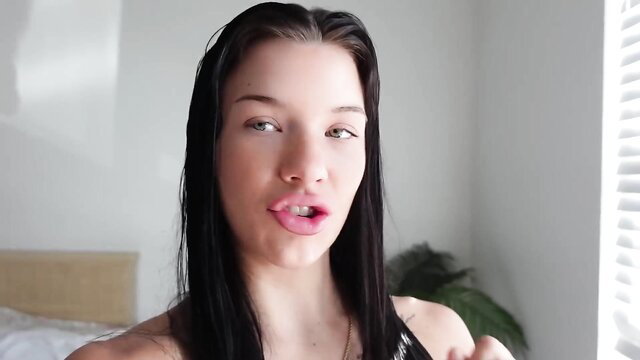 Stunning brunette with plump lips teases in lingerie, wet hair