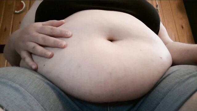 Closeup of pale BBW's massive soft belly rolls in vore fetish thumbnail