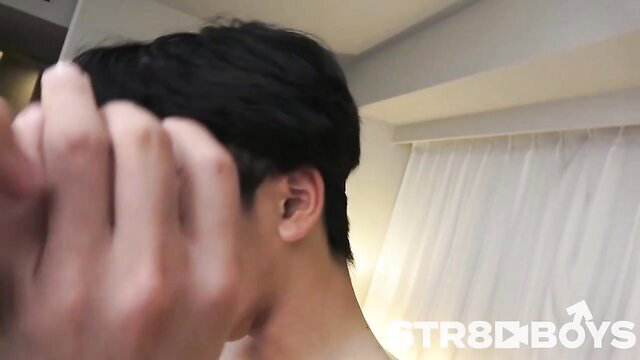 Asian twink closeup hand on neck and ear in intimate scene