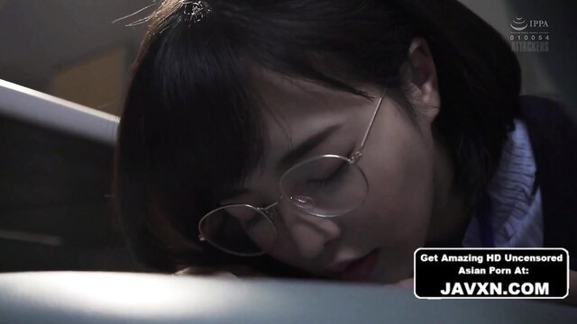 Nerdy Japanese office girl sleeping at desk in glasses