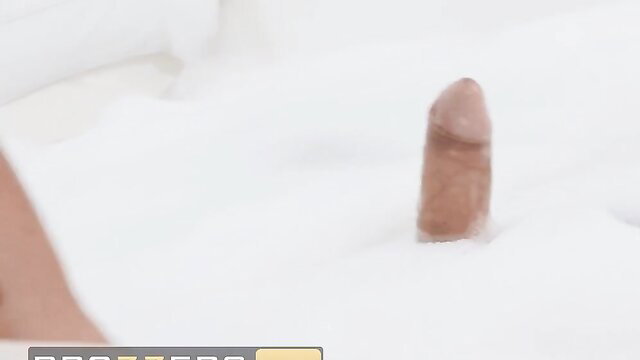 Leila Lewis' curvy ass and cock peeking from white sheets in Brazzers bathroom sneak