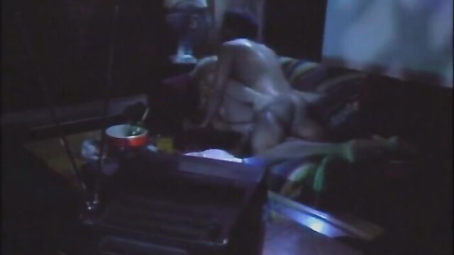 Vintage 1984 porn thumbnail: nude blonde bombshell on couch in Urban Heat