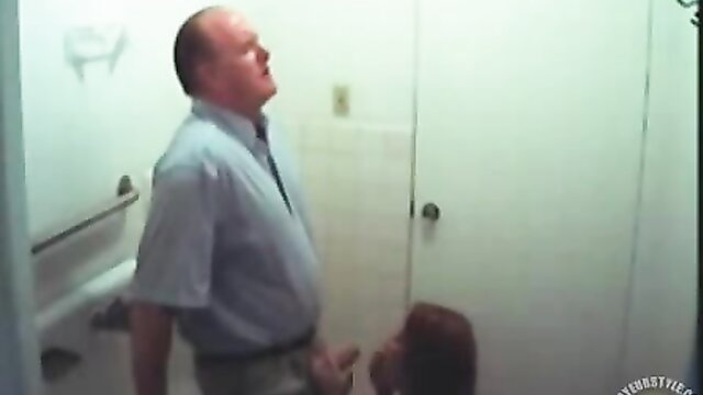 Young redhead secretary sucking boss cock in office bathroom