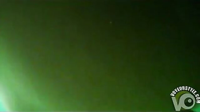 Two lovers filming hot underwater sex in glowing green pool